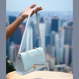 Stylish Sky Blue Hand Bag With Top Handle And Long Strap